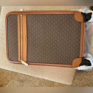 Brand new MK suitcase still with the tags and packaging